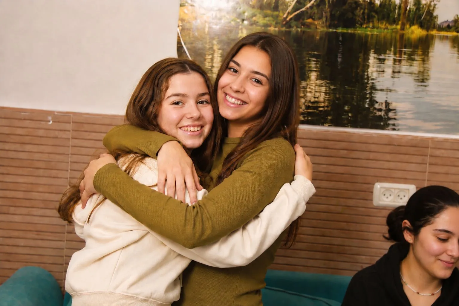 A girl hugging her mentor